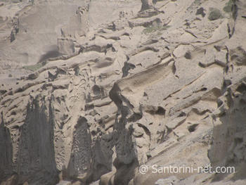 The sea-scalped rocks that are in Vlichada background.