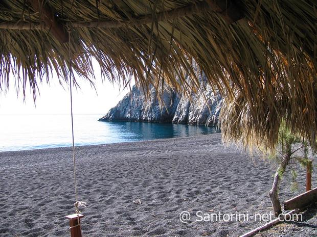 Beautiful Kamari beach Black sand of Kamari beach