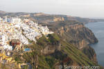 A panoramic photo of Fira, taken from Firostefani. The sun is going down.