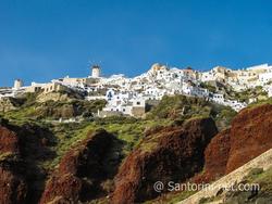 Oia village, red rocks and the famous windmill