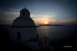 A church in Fira and the beautiful sunset
