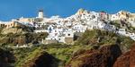 Oia village, red rocks and the famous windmill